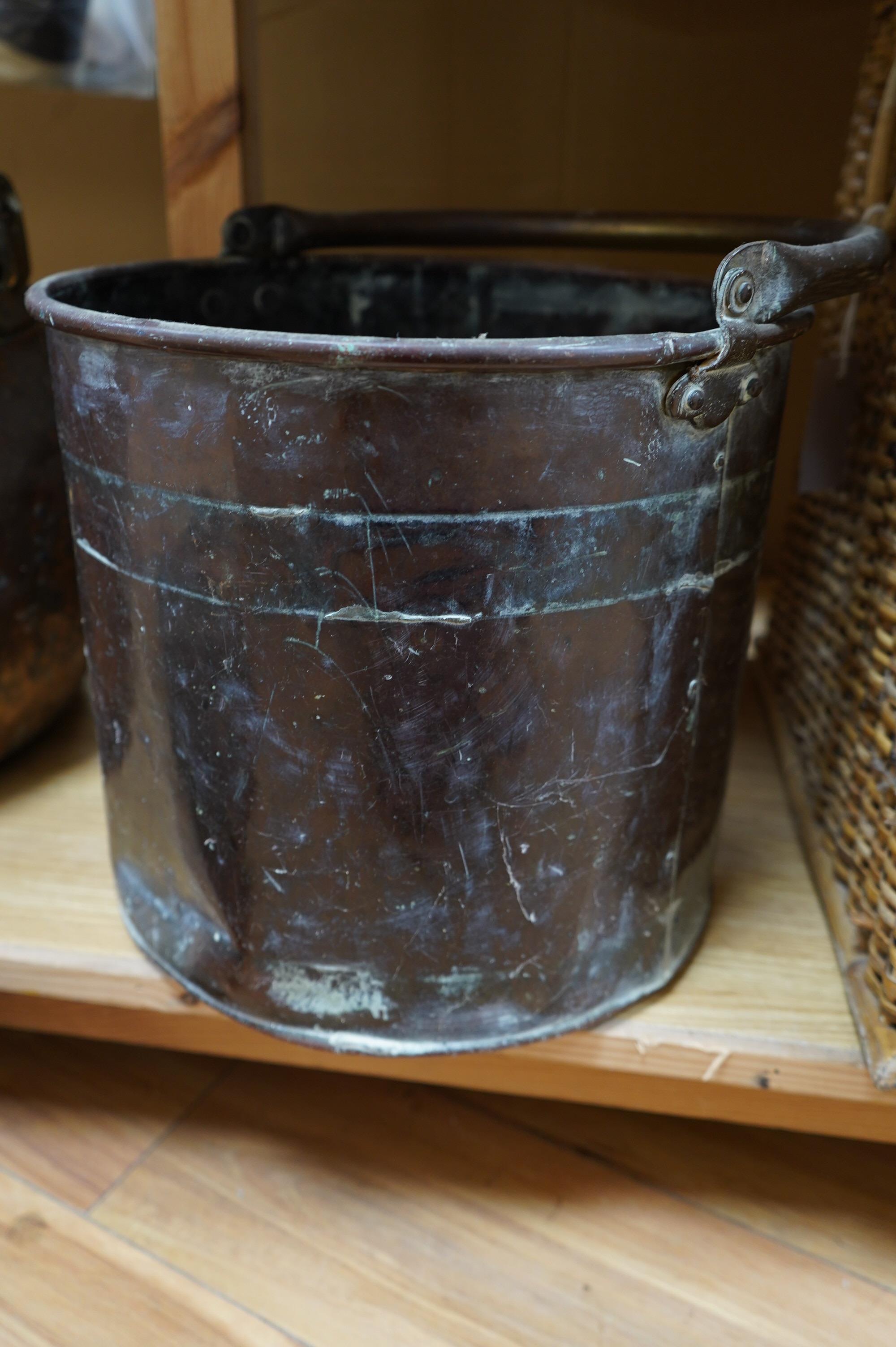 Two copper cauldrons and covers and a copper log bin (3). Condition - poor